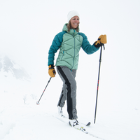 woman skiing wearing skhoop's insulated aluu pants