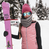 woman standing with her skis wearing down infinity scarf from skhoop