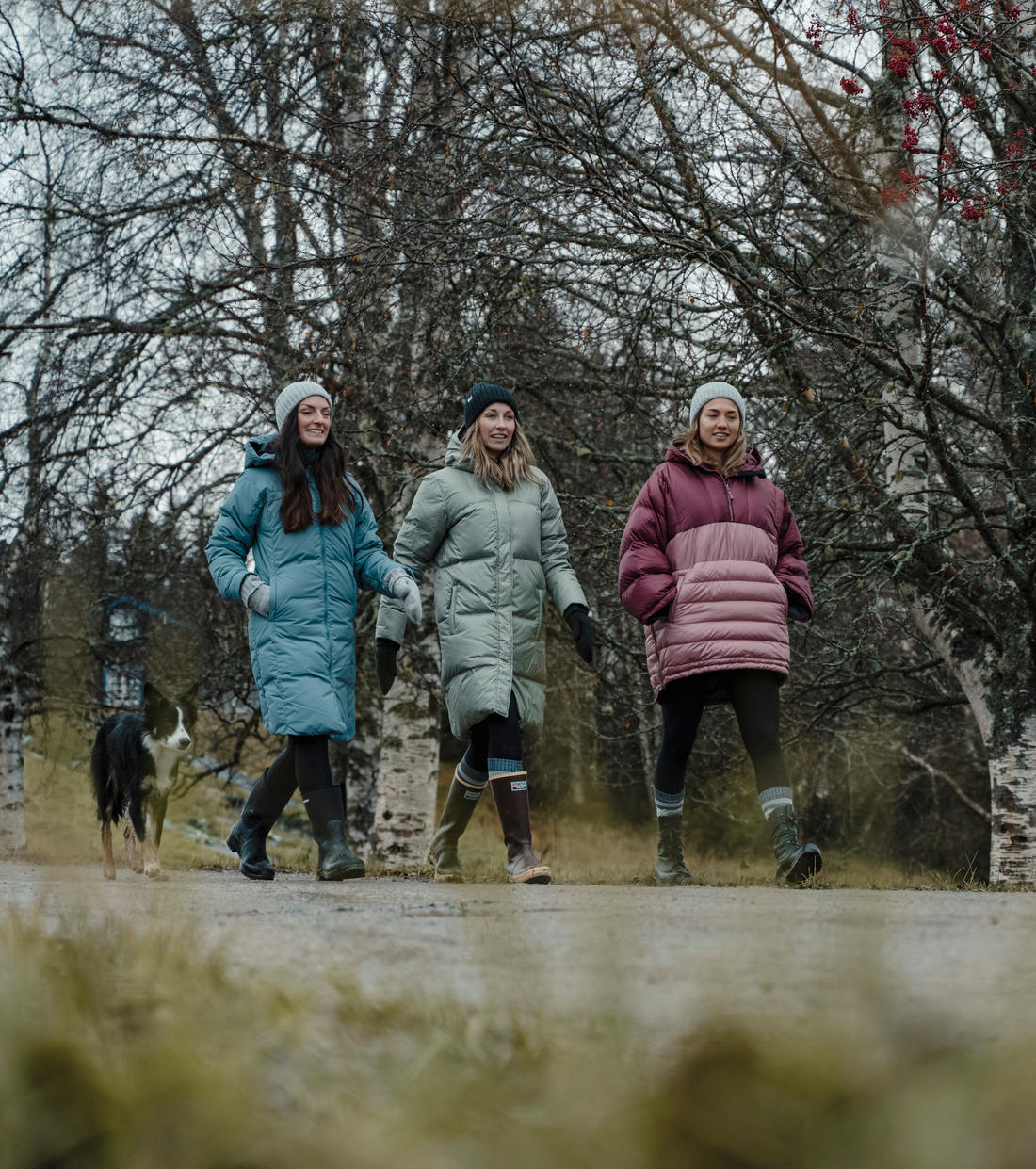 three friends walking down the street wearing puffy skhoop jackets