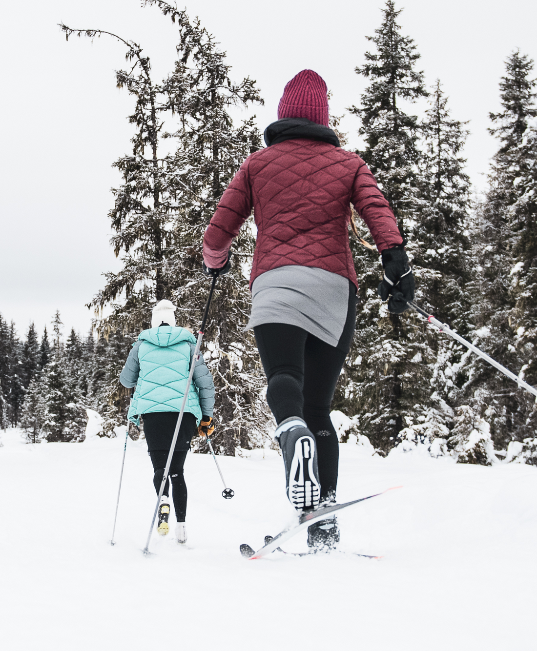 Woman skiing on a winter day in a snow skirt
