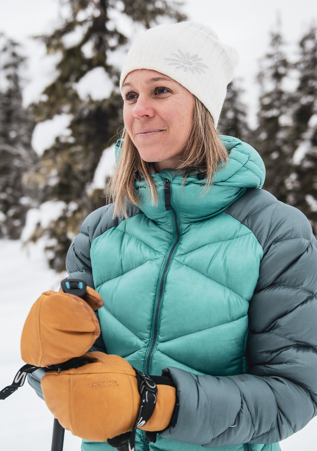 woman wearing skhoop original beanie in white on a snowy day