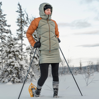woman hiking the snowy forest in skhoop snow skirt
